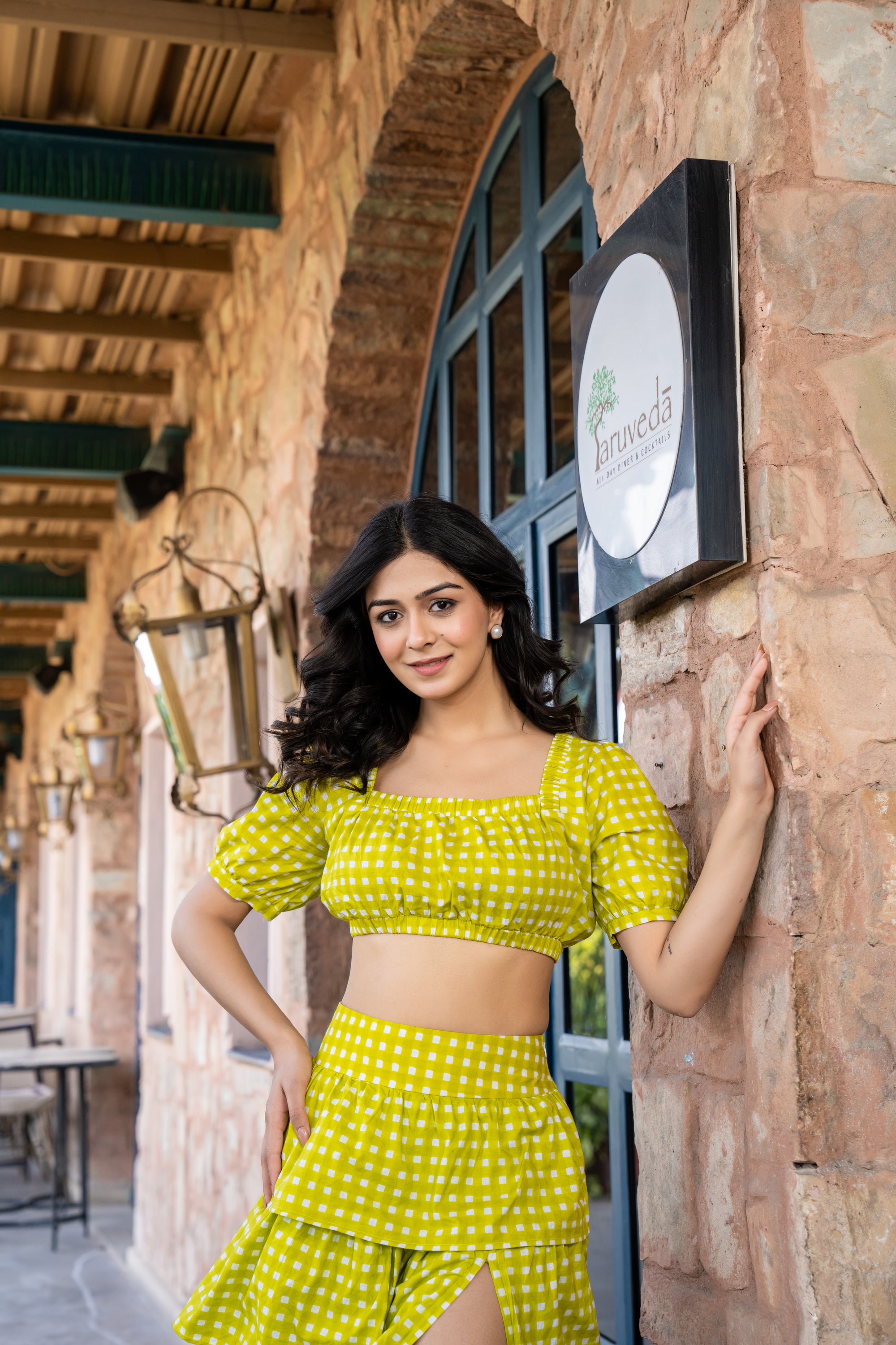 Side view of lime green ruffle skirt with slit